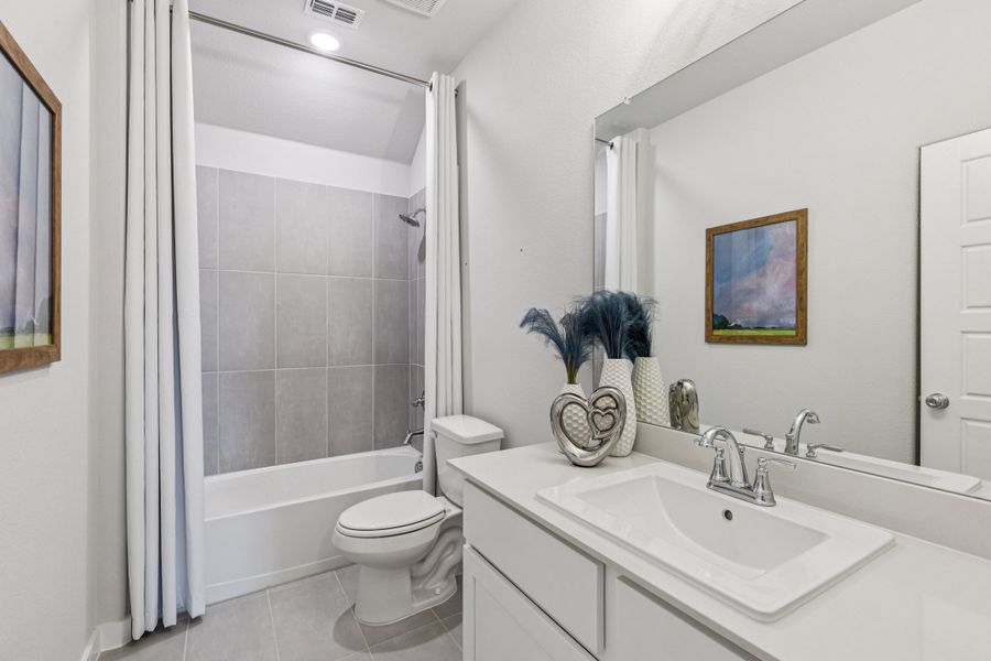 REPRESENTATIVE PHOTO – Bathroom in the Oscar model home in Aledo TX by Trophy Signature Homes