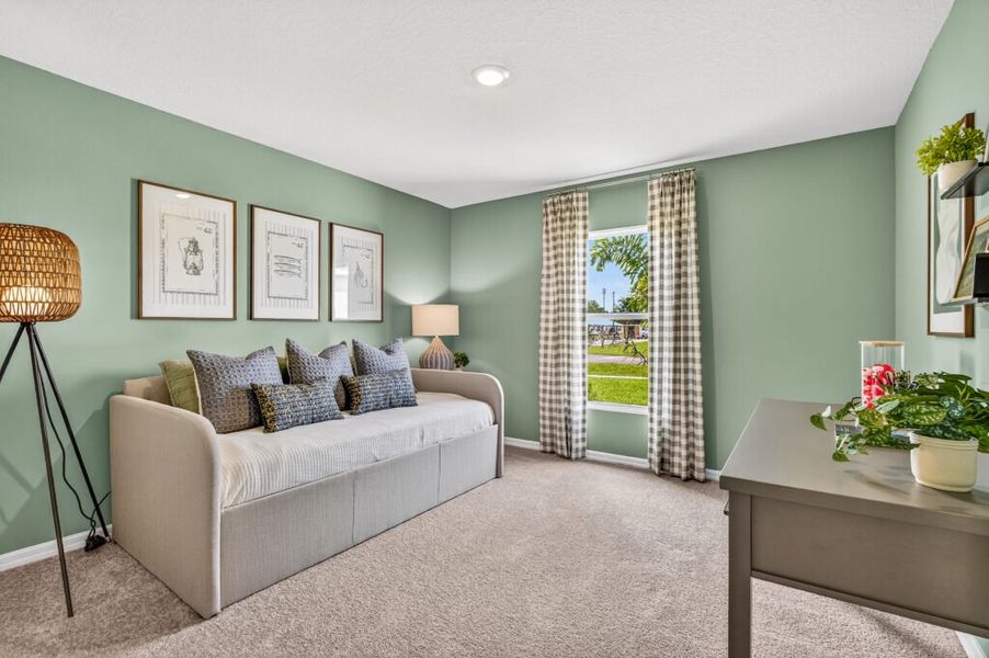 Furnished interior in a model home at Mallard Landing in Okeechobee (Image 17).