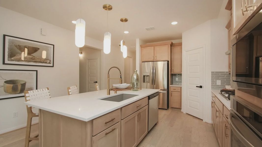 Luxurious kitchen with quartz countertops, custom cabinetry, stainless steel appliances in Ellis Cove. Luxurious kitchen with quartz countertops, custom cabinetry, stainless steel appliances in Ellis Cove.