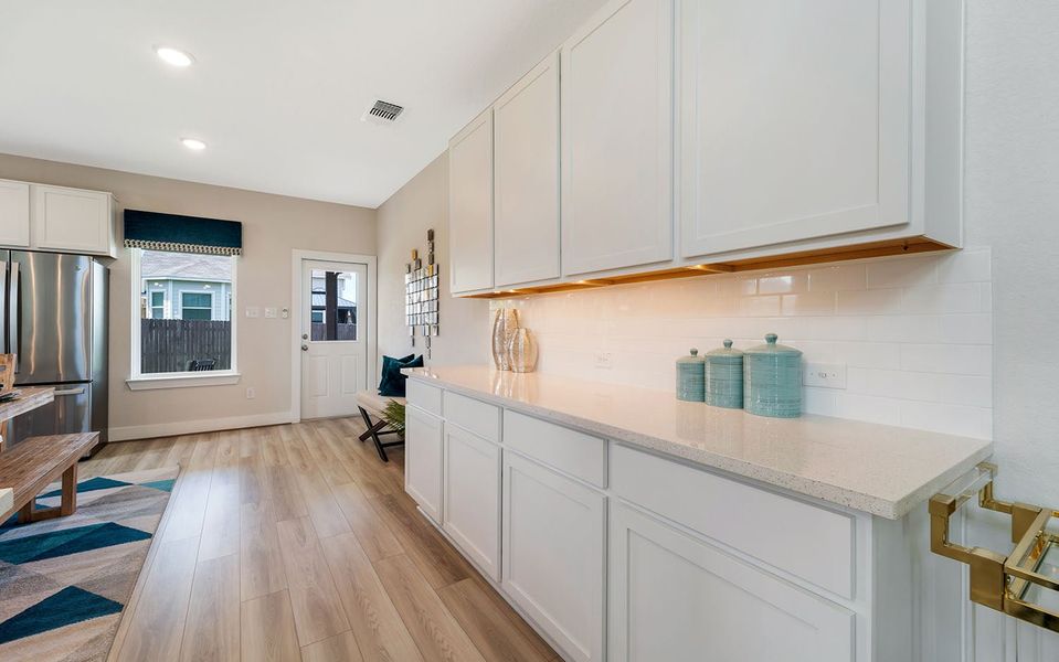 Furnished interior in a model home at Hunter's Ranch in San Antonio (Image 22).