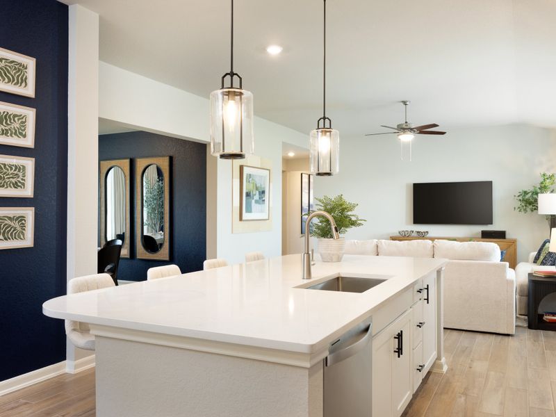 Kitchen, living, and dining room in the Rio Grande floorplan at a Meritage Homes community.