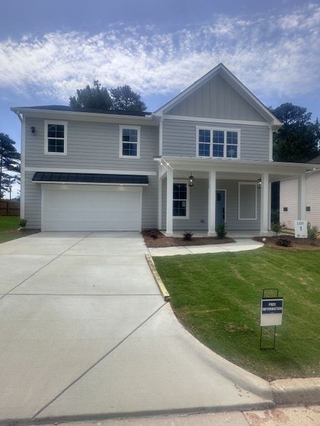 A modern gray two-story home with a welcoming porch in Creekside by MacBuilt Homes (Decatur, GA). A modern gray two-story home with a welcoming porch in Creekside by MacBuilt Homes (Decatur, GA).