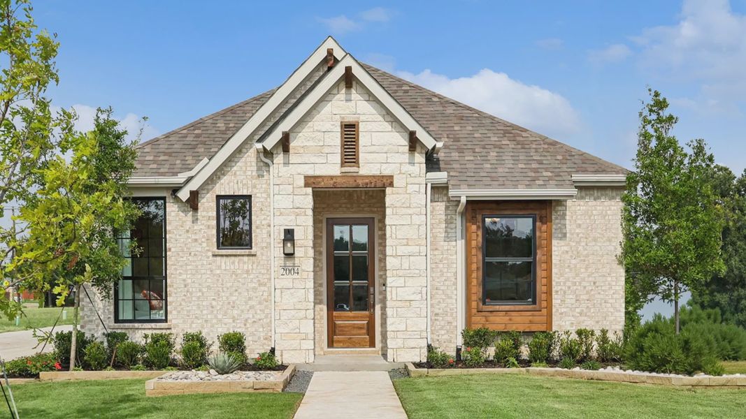 Front exterior of a home in the Heritage Park community, located in Garland, TX (Image 1).