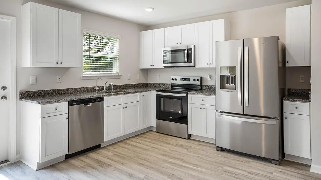 Furnished interior in a model home at Sunny Hills in Chipley (Image 13).