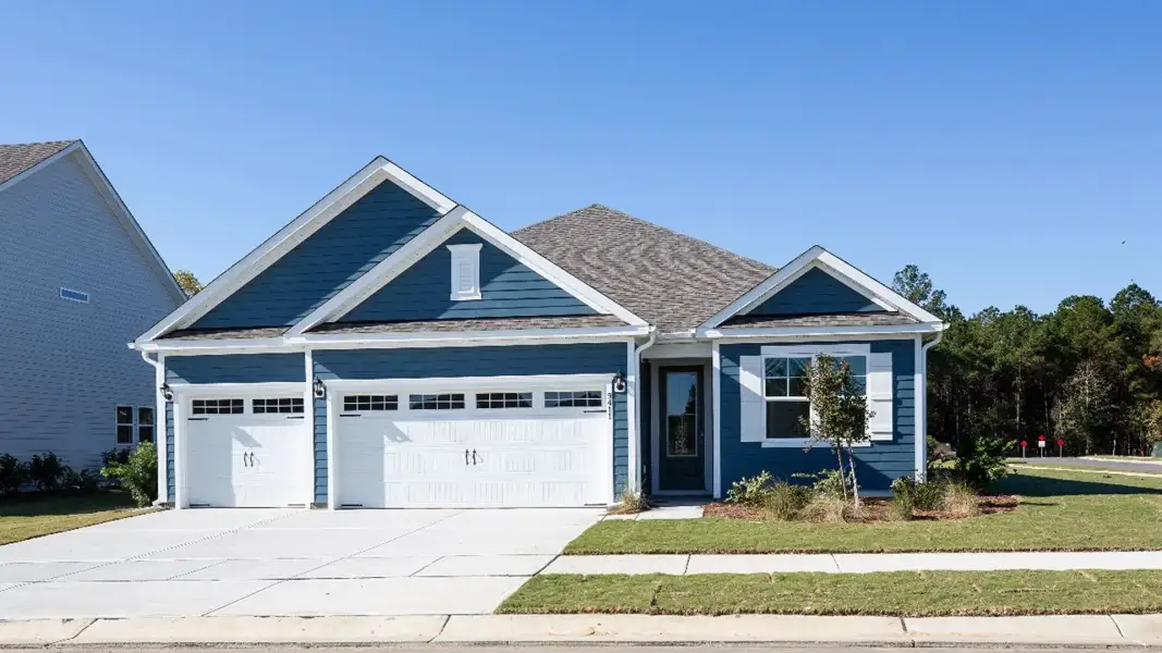 Front exterior of a home in the The Highlands at Cedar Hill Landing community, located in Navassa, NC (Image 4). Front exterior of a home in the The Highlands at Cedar Hill Landing community, located in Navassa, NC (Image 4).