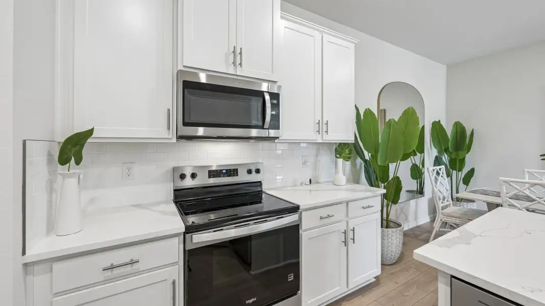 Furnished interior in a model home at Gladstone Park Villas in Sarasota (Image 5).