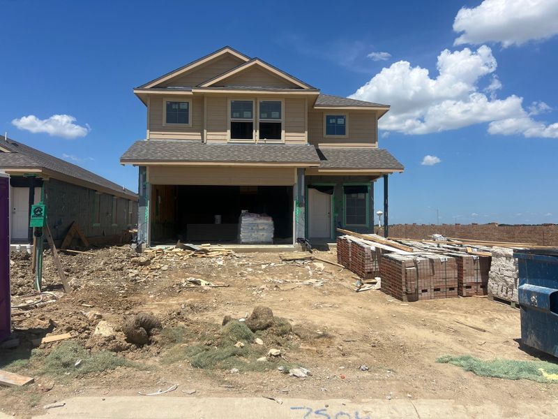 A modern two-story home under construction in Monarch at the Meadows by D.R. Horton, Denton, TX. A modern two-story home under construction in Monarch at the Meadows by D.R. Horton, Denton, TX.