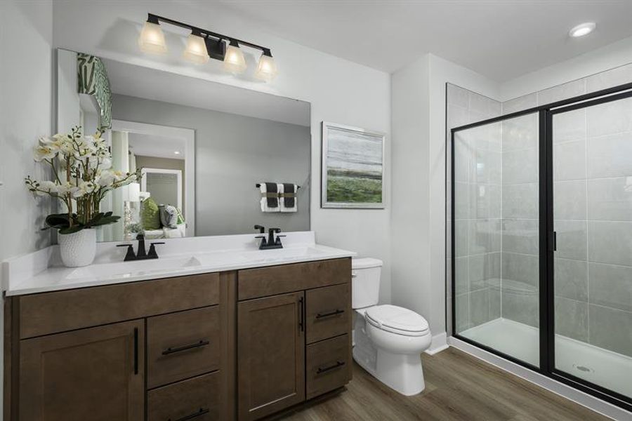 Dual vanities offer personal space and morning routine ease.