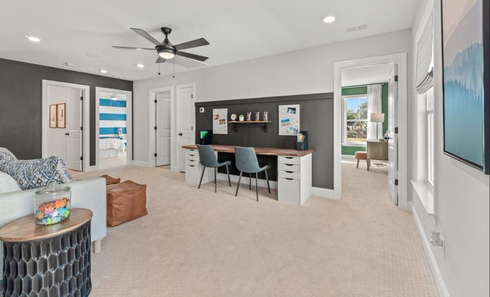 Furnished interior in a model home at Enclave at Riverdale in Huntersville (Image 9).