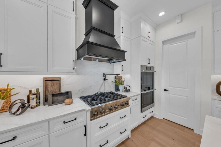 Furnished interior in a model home at Hampton Lakes in Sarasota (Image 147).