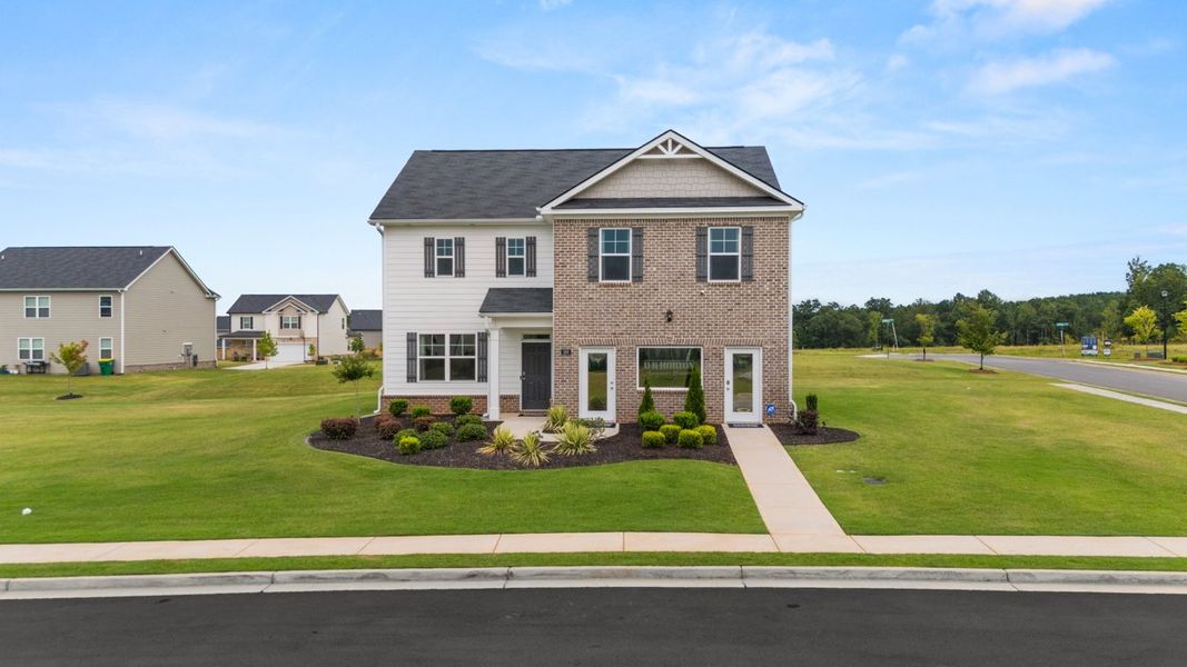 Front exterior of a home in the Locust Grove Station - Cedar Ridge community, located in Locust Grove, GA (Image 4).