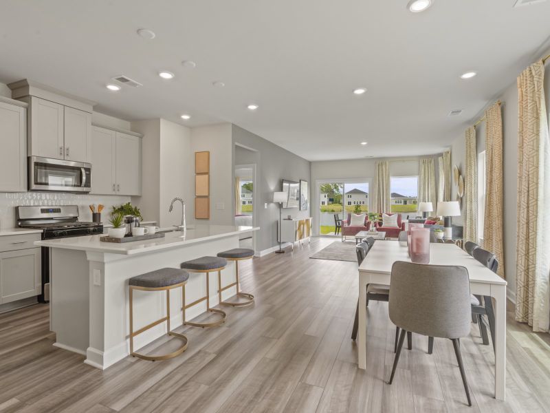 The well-appointed kitchen features a large island to make meal prep a breeze.