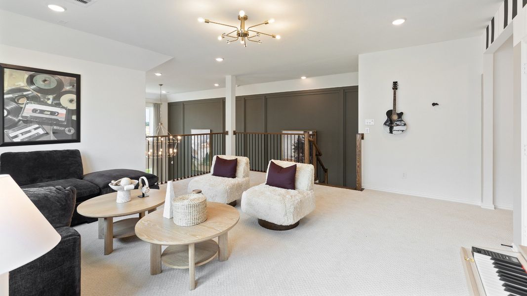 Spacious upstairs game room in the Rosewood model overlooking the family room making entertaining easy and fun.