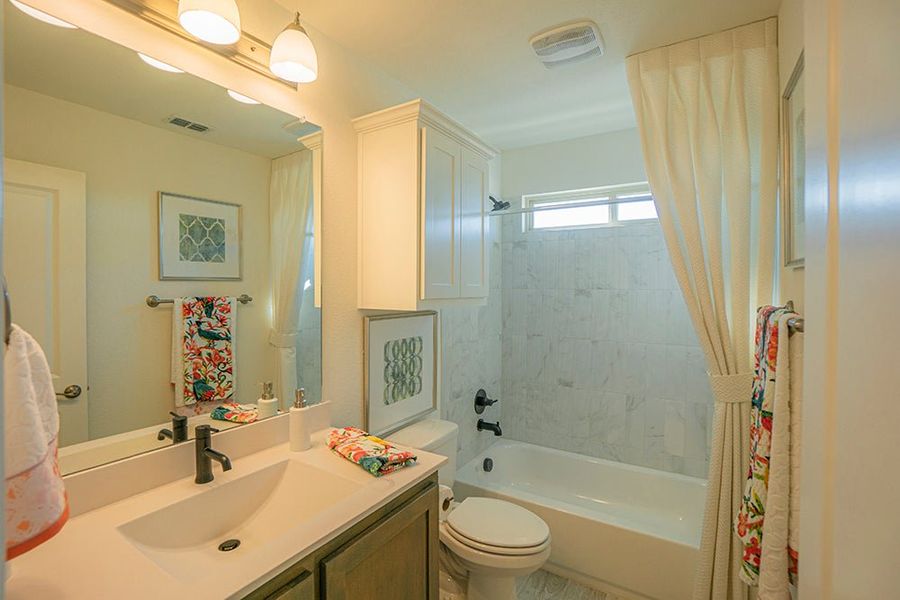 Furnished interior in a model home at Woodcreek in Fate (Image 25).