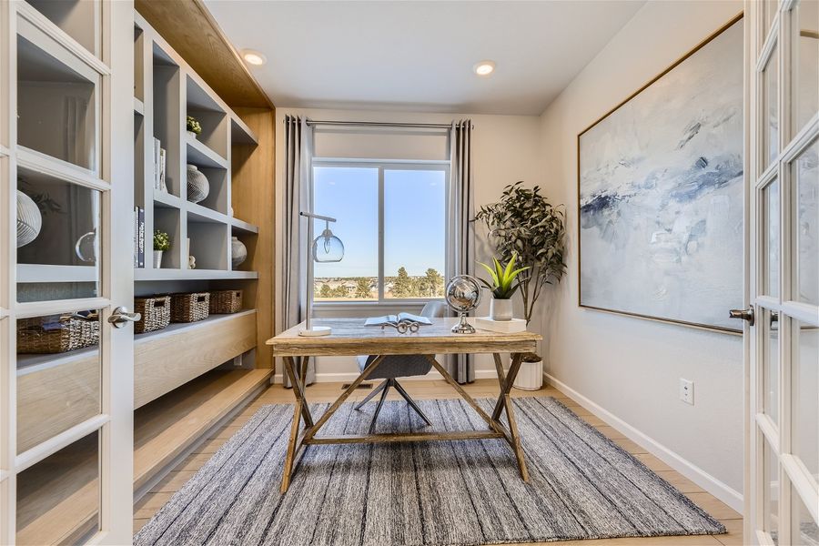 A room with a table and shelves.