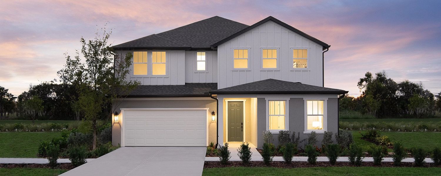 Front exterior of a home in the Oakfield Trails Signature community, located in Parrish, FL (Image 1).