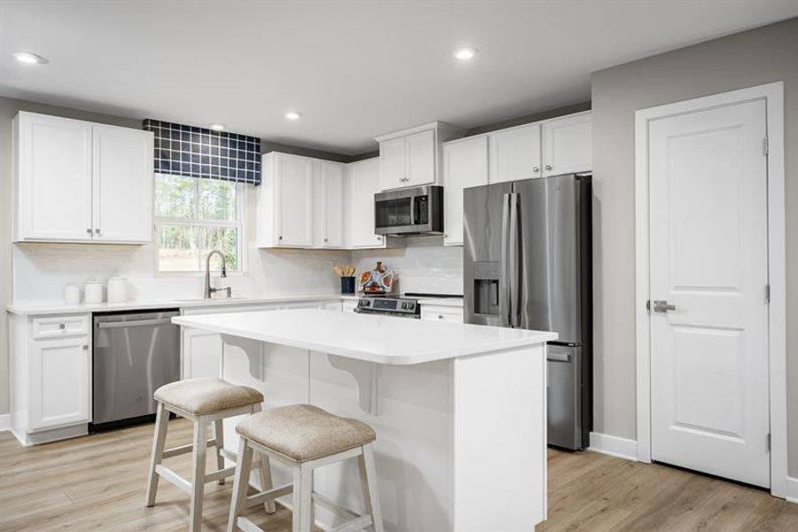 Light-filled kitchens with included quartz & stainless appliances for easy living Light-filled kitchens with included quartz & stainless appliances for easy living
