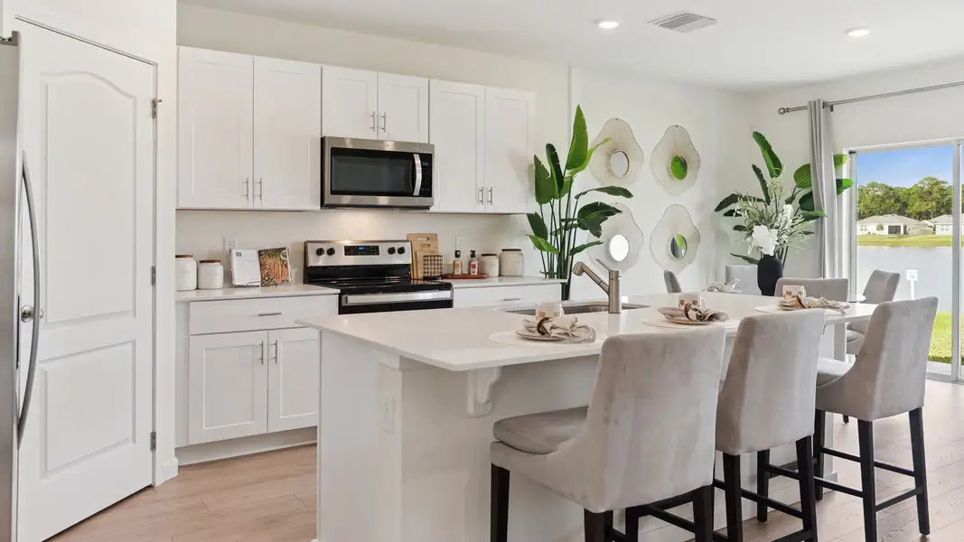 Furnished interior in a model home at Kindred in Kissimmee (Image 6).