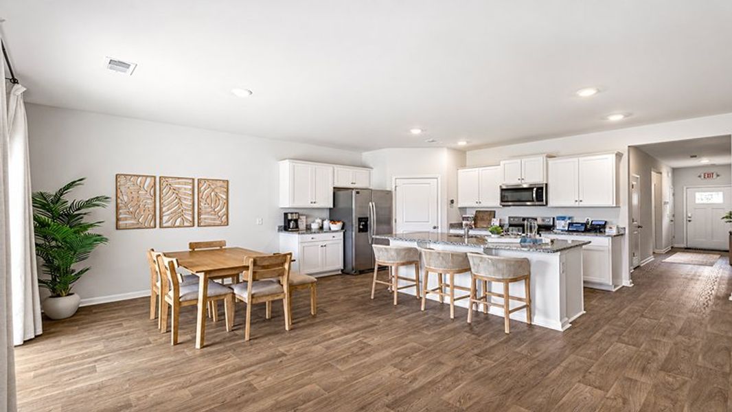 Furnished interior in a model home at Pine Hills at Cane Bay in Summerville (Image 5).