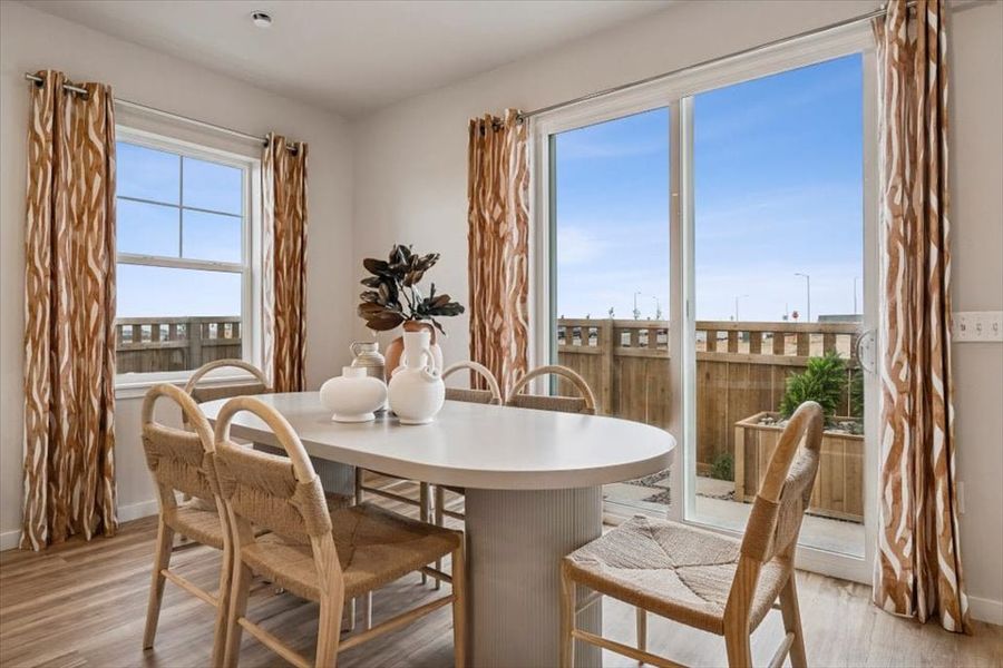 A dining table with chairs around it. A dining table with chairs around it.