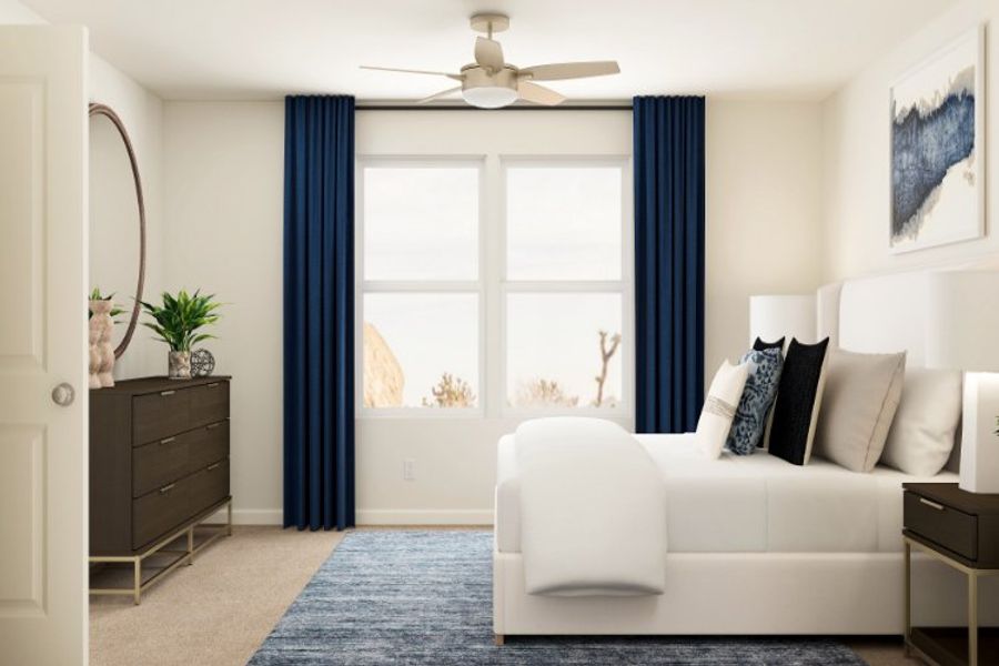 A living room with a white couch and a fan.
