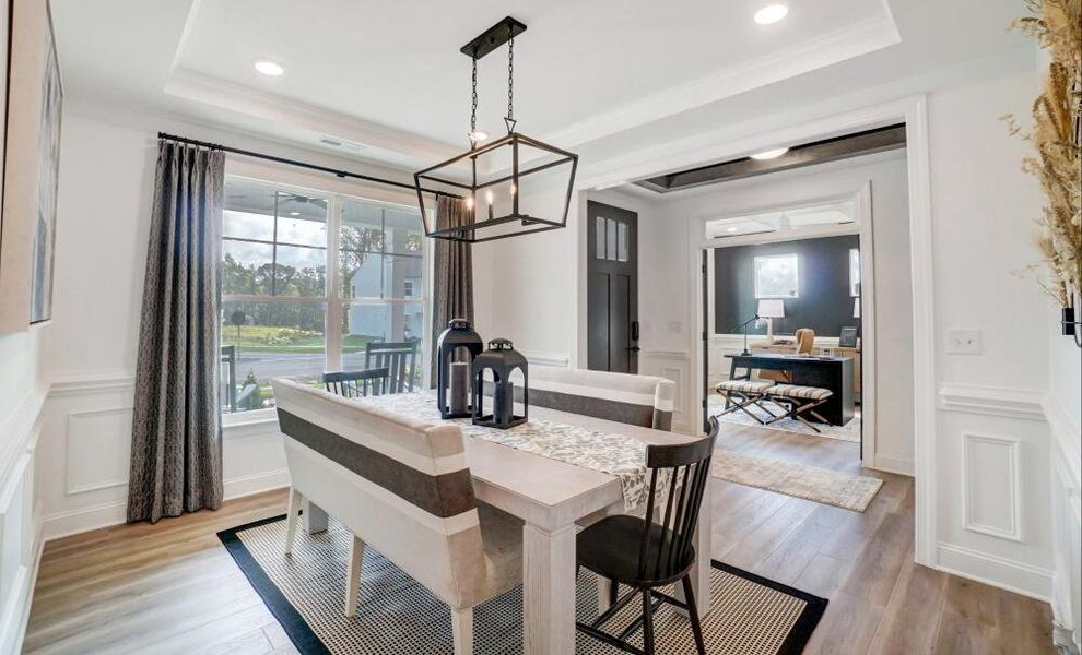 Furnished interior in a model home at Peyton's Creek in Statesville (Image 3).