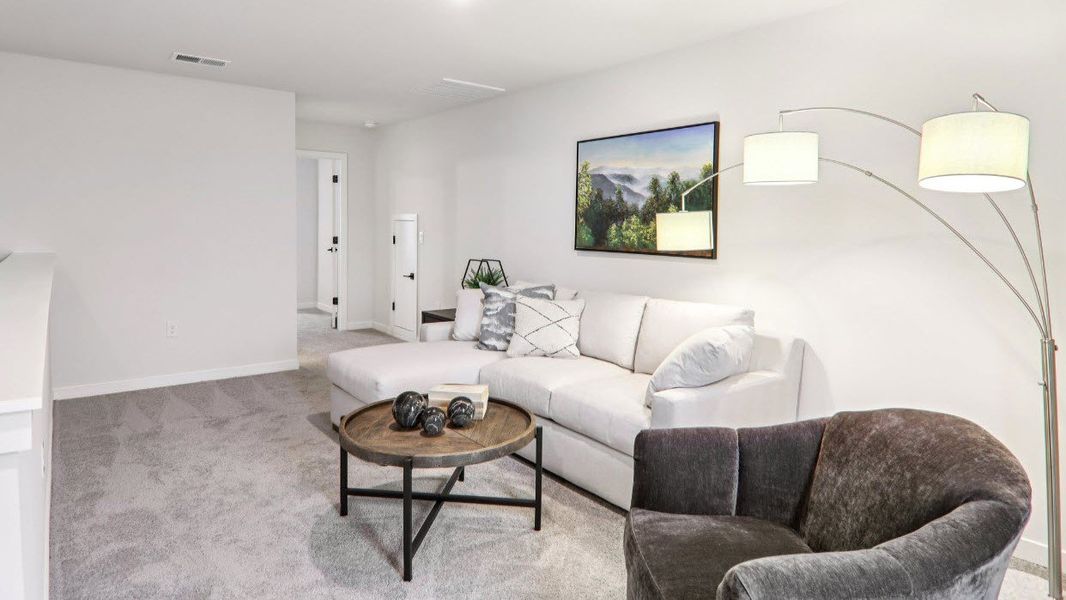 Furnished interior in a model home at Reserve at Tap Root Farms in Fletcher (Image 25).