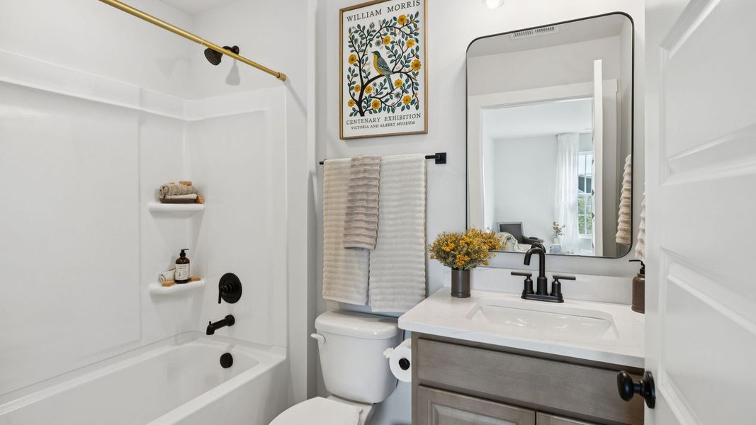 Furnished interior in a model home at Harvest Point in Spring Hill (Image 49).