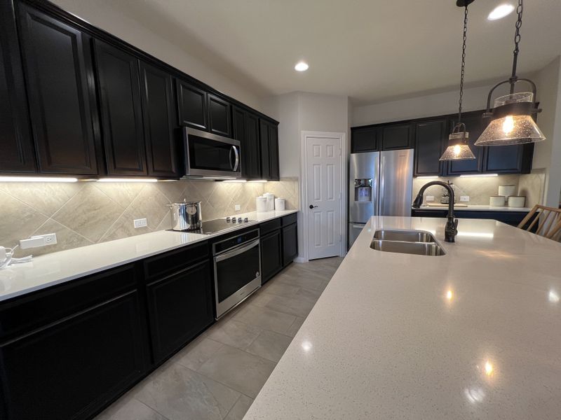 Furnished interior in a model home at Summerlyn in Leander (Image 23).