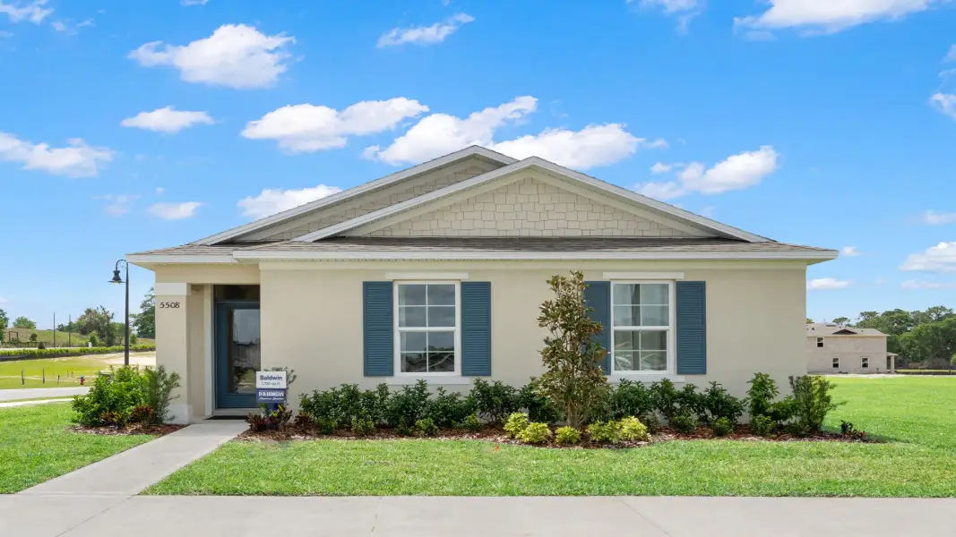 Front exterior of a home in the Tranquility community, located in St. Cloud, FL (Image 3).