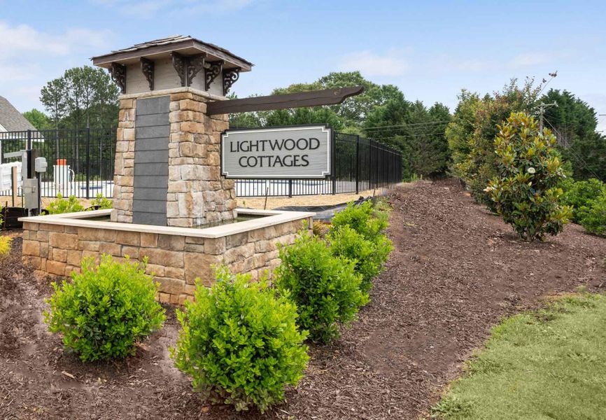 Entrance to the Lightwood Cottages community in Moore, SC, featuring signage and landscaping (Image 1).