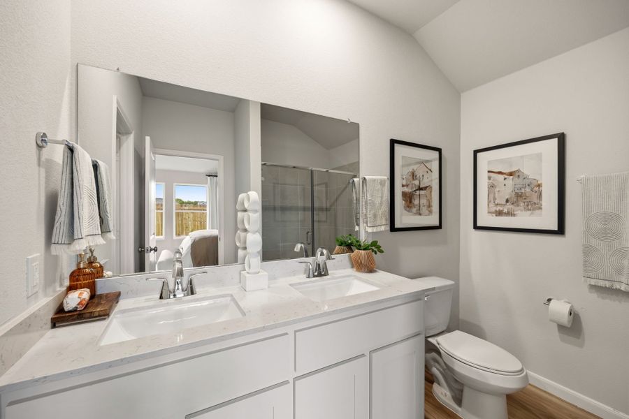 A bathroom with a large mirror. A bathroom with a large mirror.