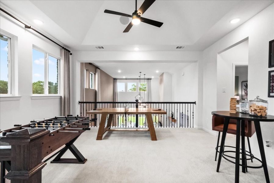 Furnished interior in a model home at The Reserve at Spiritas Ranch in Little Elm (Image 29).