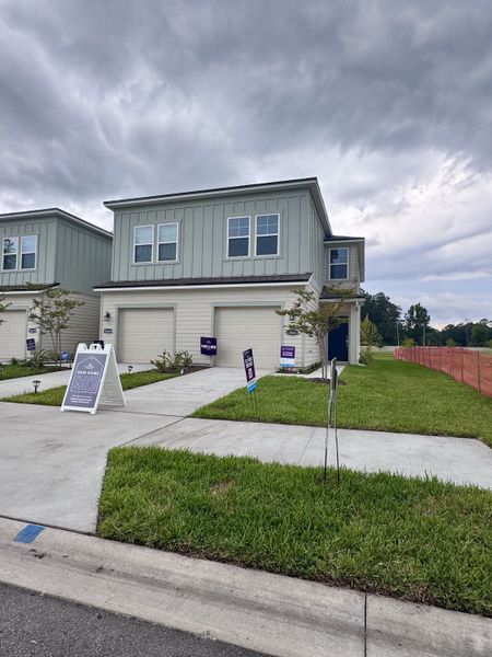 Stylish modern home with a two-car garage in The Villas at Bishop Oaks by Century Communities (Jacksonville, FL).
