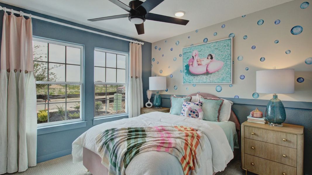 Stylish Prairie Green bedroom features large windows and unique bubble-themed wall art for luxurious living.