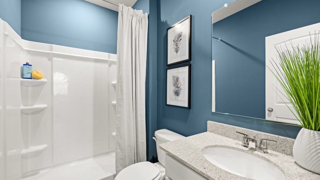 Furnished interior in a model home at Liberty Crossing in Braselton (Image 13).