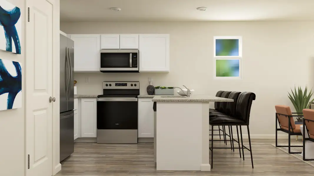 A kitchen with white cabinets.