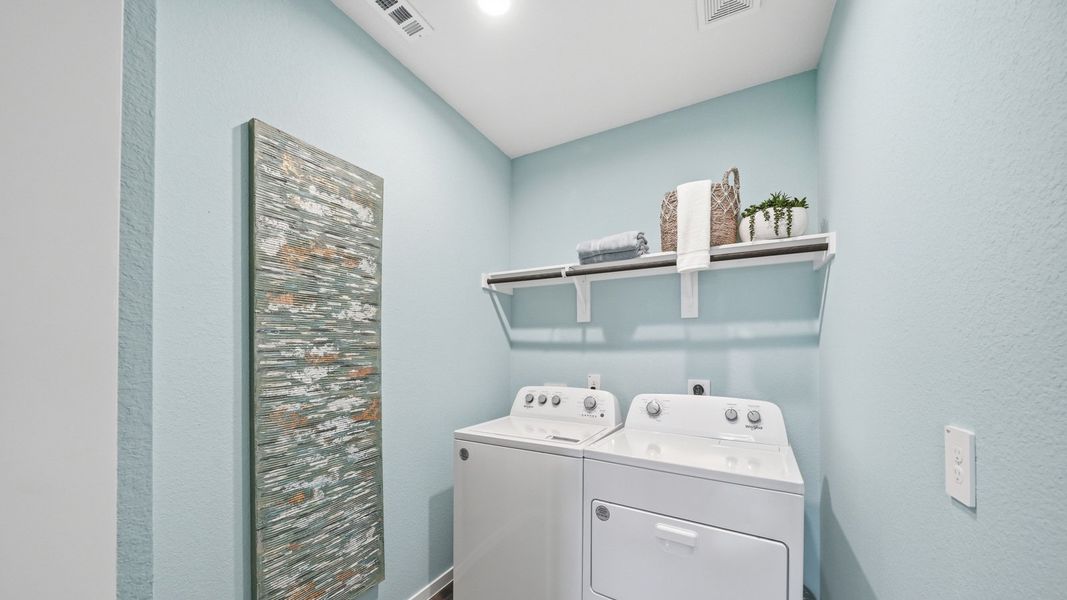 Furnished interior in a model home at Sunterra in Katy (Image 41).