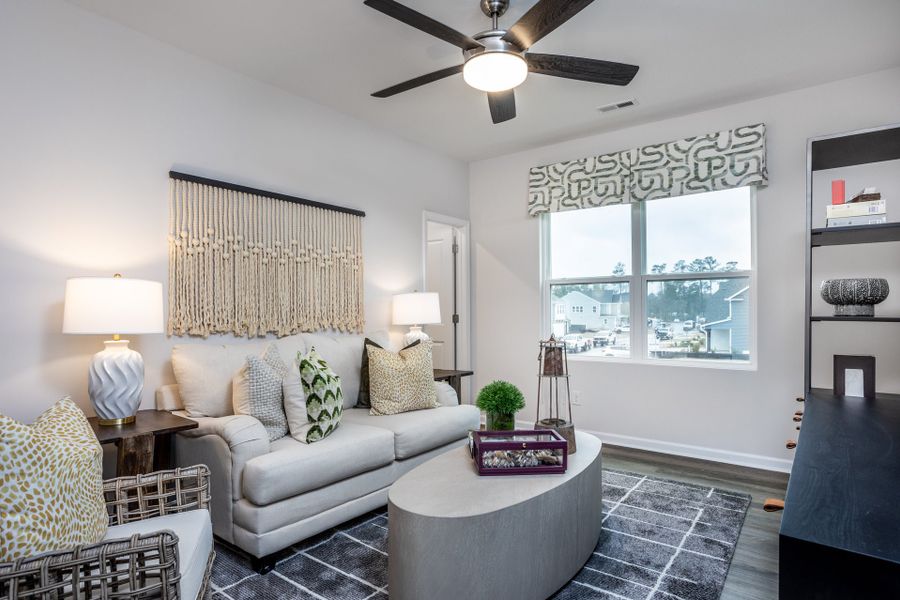 Furnished interior in a model home at Coastal Haven Townes in Leland (Image 8).
