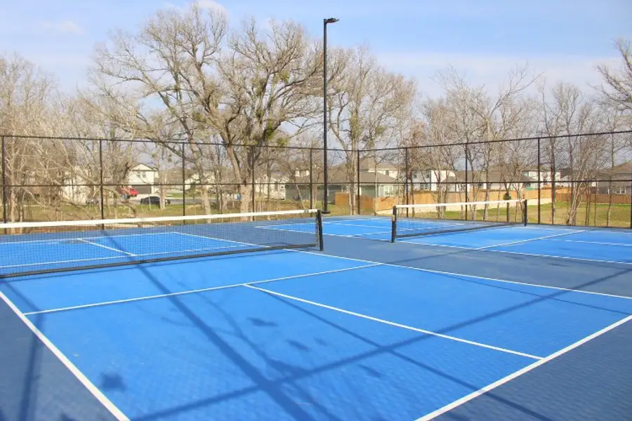 A tennis court with a net.