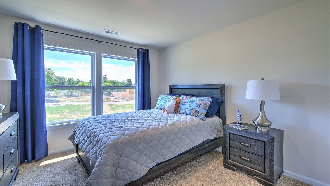 Furnished interior in a model home at Townes at Tap Root Farms in Fletcher (Image 20).
