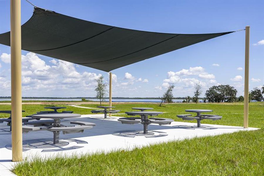 Take in beautiful lake views from a shaded seating area, perfect for relaxing outdoors. Take in beautiful lake views from a shaded seating area, perfect for relaxing outdoors.