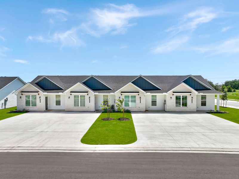 Front exterior of a home in the Townhomes at Yaupon Trails community, located in Bryan, TX (Image 3).