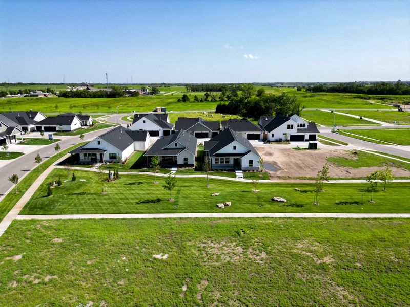 Aerial view of the The Courtyards at The Moorings community in Wichita, KS, showing layout and nearby surroundings (Image 9).