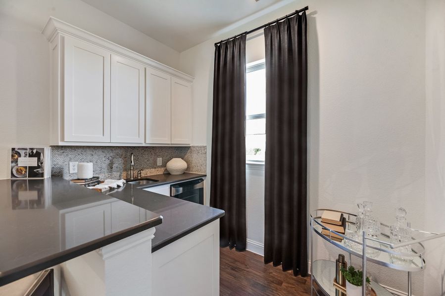 Furnished interior in a model home at King's Crossing in Parker (Image 9).
