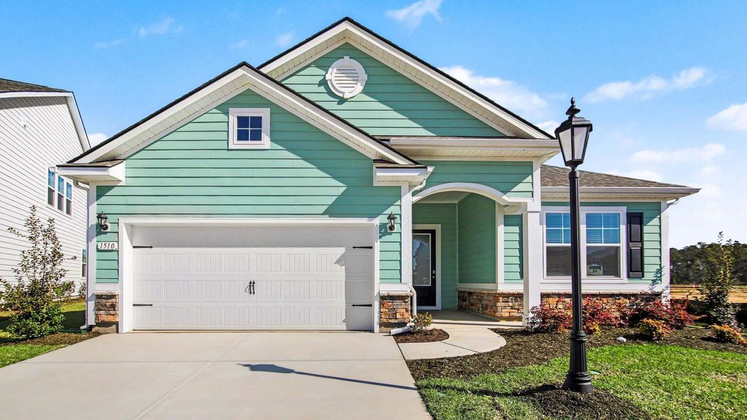 Front exterior of a home in the Brunswick Plantation community, located in Ash, NC (Image 5). Front exterior of a home in the Brunswick Plantation community, located in Ash, NC (Image 5).
