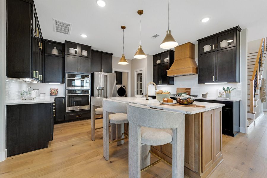 Furnished interior in a model home at Sunterra Lakes in Brookshire (Image 20).