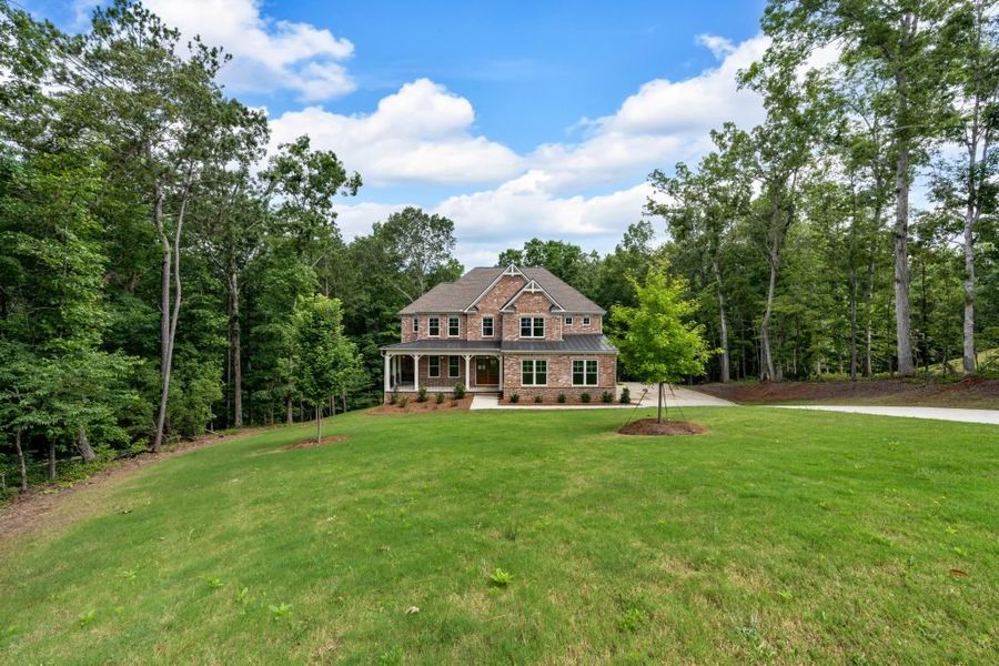 Front exterior of a home in the The Estates at Hurricane Pointe community, located in Douglasville, GA (Image 11).