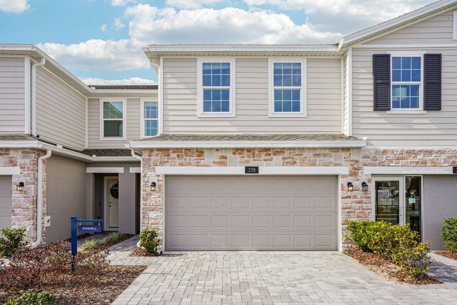 Front exterior of a home in the Thompson Village Townhomes community, located in Apopka, FL (Image 3).