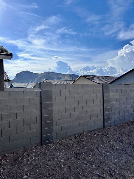 Modern home with mountain views and stylish brickwork in Canyon Views by Starlight Homes (Litchfield Park, AZ).